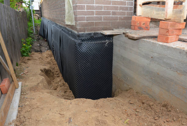 SJ Waterproofing Pros technician performing targeted Vapor Barrier Installation assessment in Richfield, MN